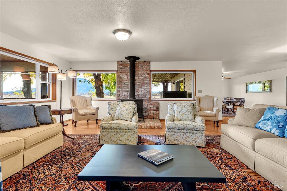 41579 Osprey Road Fall River Mills, CA 96028 - Photo 19 of 67 a living room with furniture and a large window
