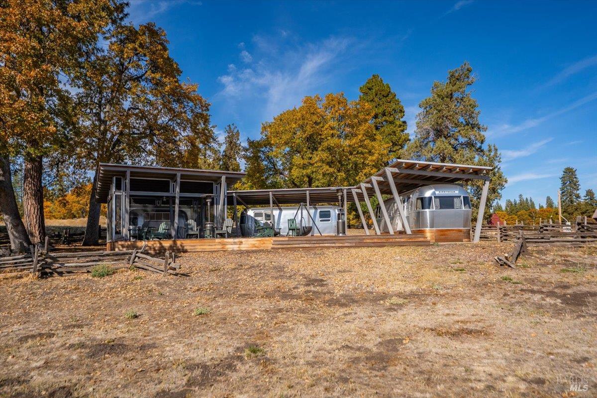 41579 Osprey Road Fall River Mills, CA 96028 - Photo 38 of 67 a front view of a house with a yard