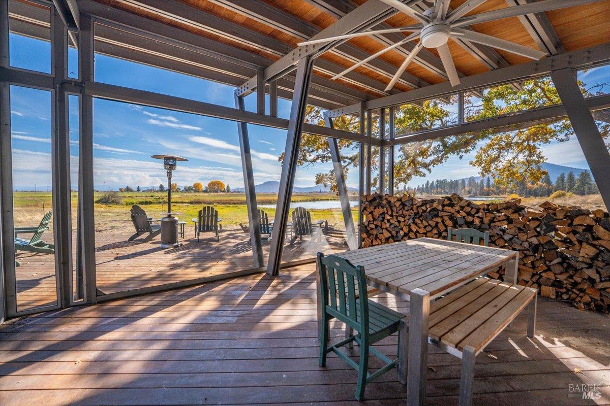 41579 Osprey Road Fall River Mills, CA 96028 - Photo 41 of 67 a view of a patio with a table and chairs