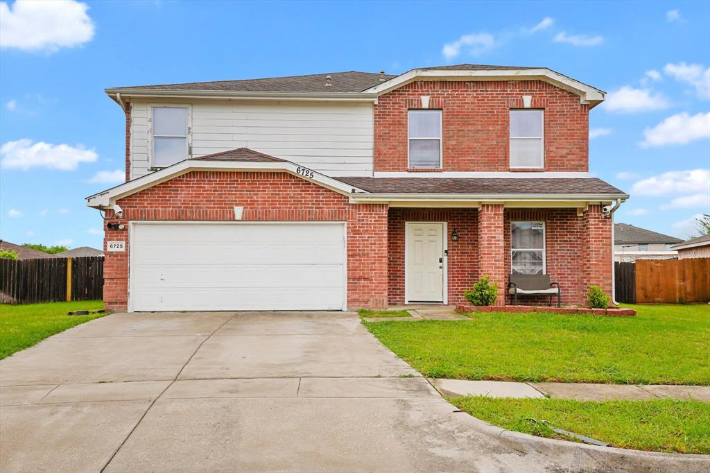 6725 Prairie Fire Road Arlington, TX 76002 - Photo 1 of 31 a front view of a house with a yard and garage