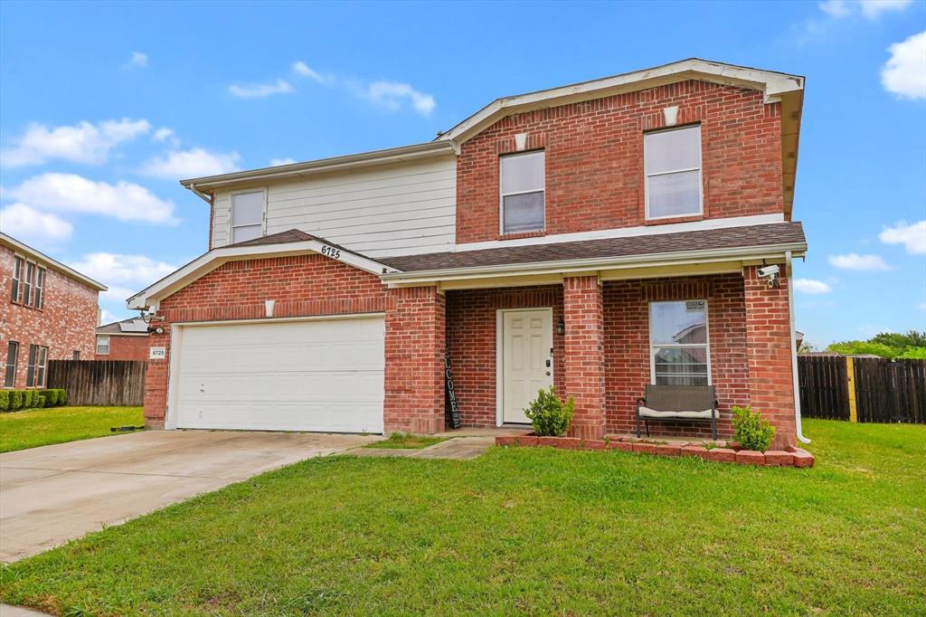 6725 Prairie Fire Road Arlington, TX 76002 - Photo 2 of 31 a front view of a house with a yard
