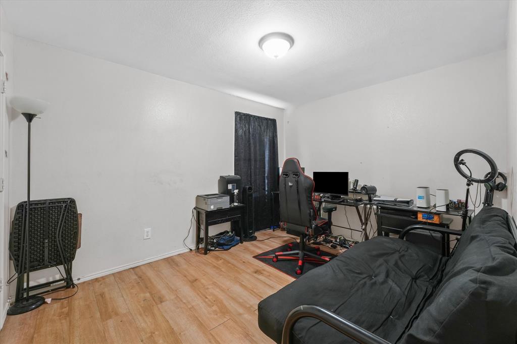 6725 Prairie Fire Road Arlington, TX 76002 - Photo 25 of 31 a view of a workspace with furniture and a window