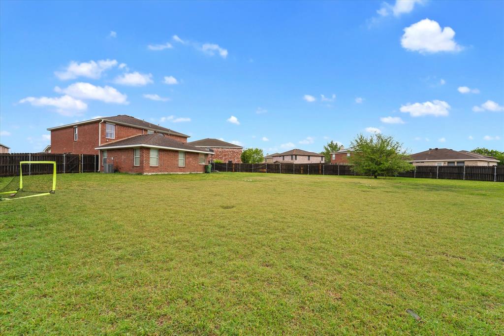 6725 Prairie Fire Road Arlington, TX 76002 - Photo 31 of 31 a view of a house with a big yard