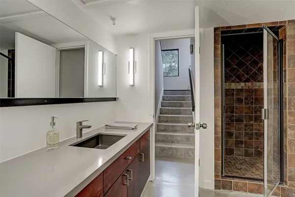 a kitchen with a sink and cabinets