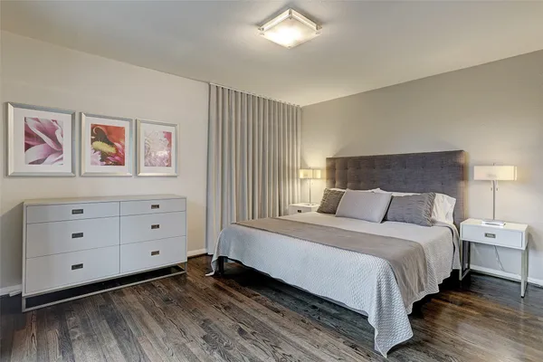 a bed room with a bed and a window