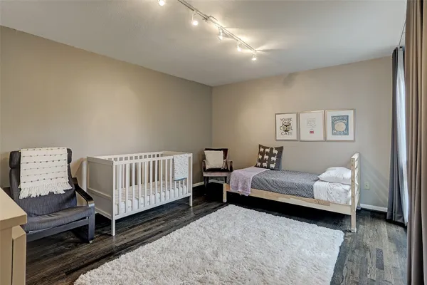 a bedroom with furniture and a window