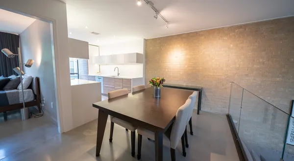 a view of a dining room with furniture and wooden floor