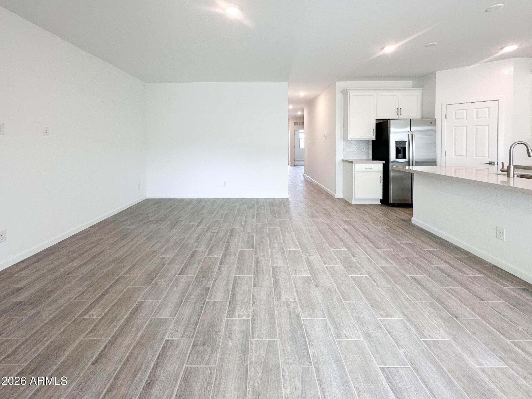 47637 West Moeller Road Maricopa, AZ 85139 - Photo 6 of 19 a view of kitchen view wooden floor and stainless steel appliances
