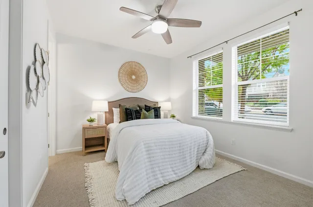 a bedroom with a bed and window