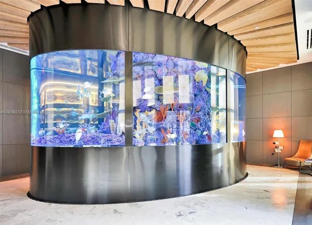 a view of a wooden door with a couple of buildings