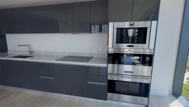 a kitchen with a stove and a microwave