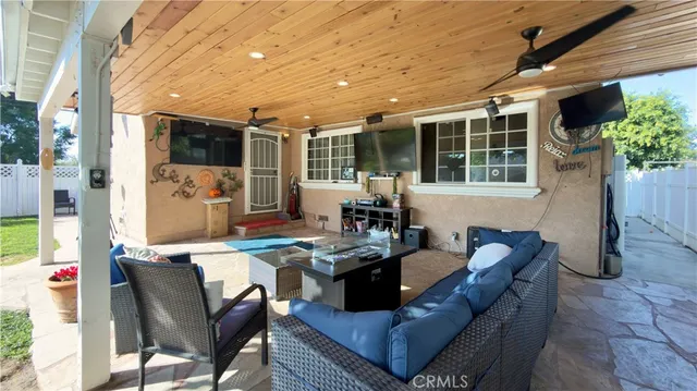 a outdoor space with patio furniture and potted plants