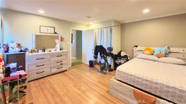 a bed room with a bed and a tv