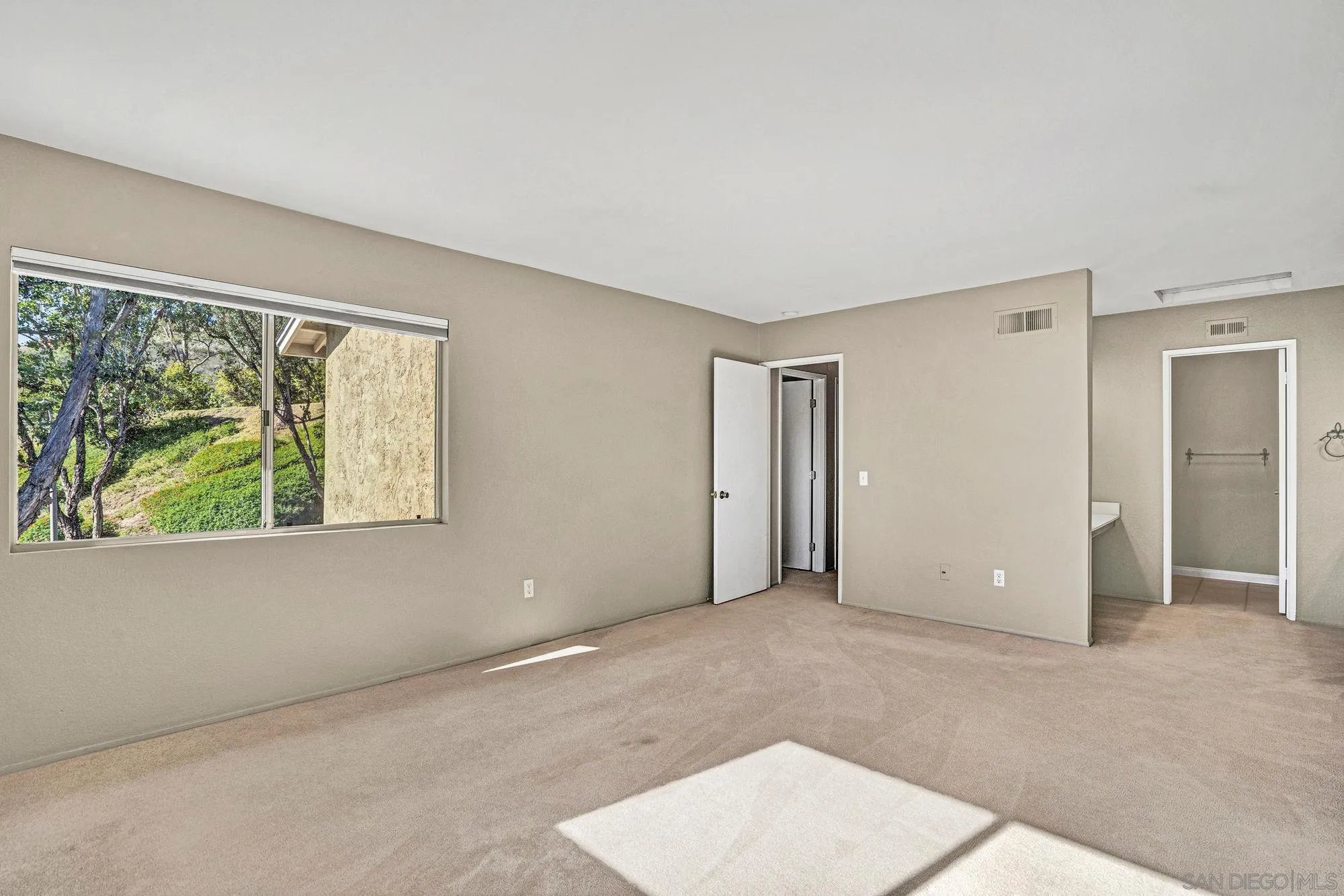 13644 Mulberry Tree Court Poway, CA 92064 - Photo 14 of 37 an empty room with windows and closet