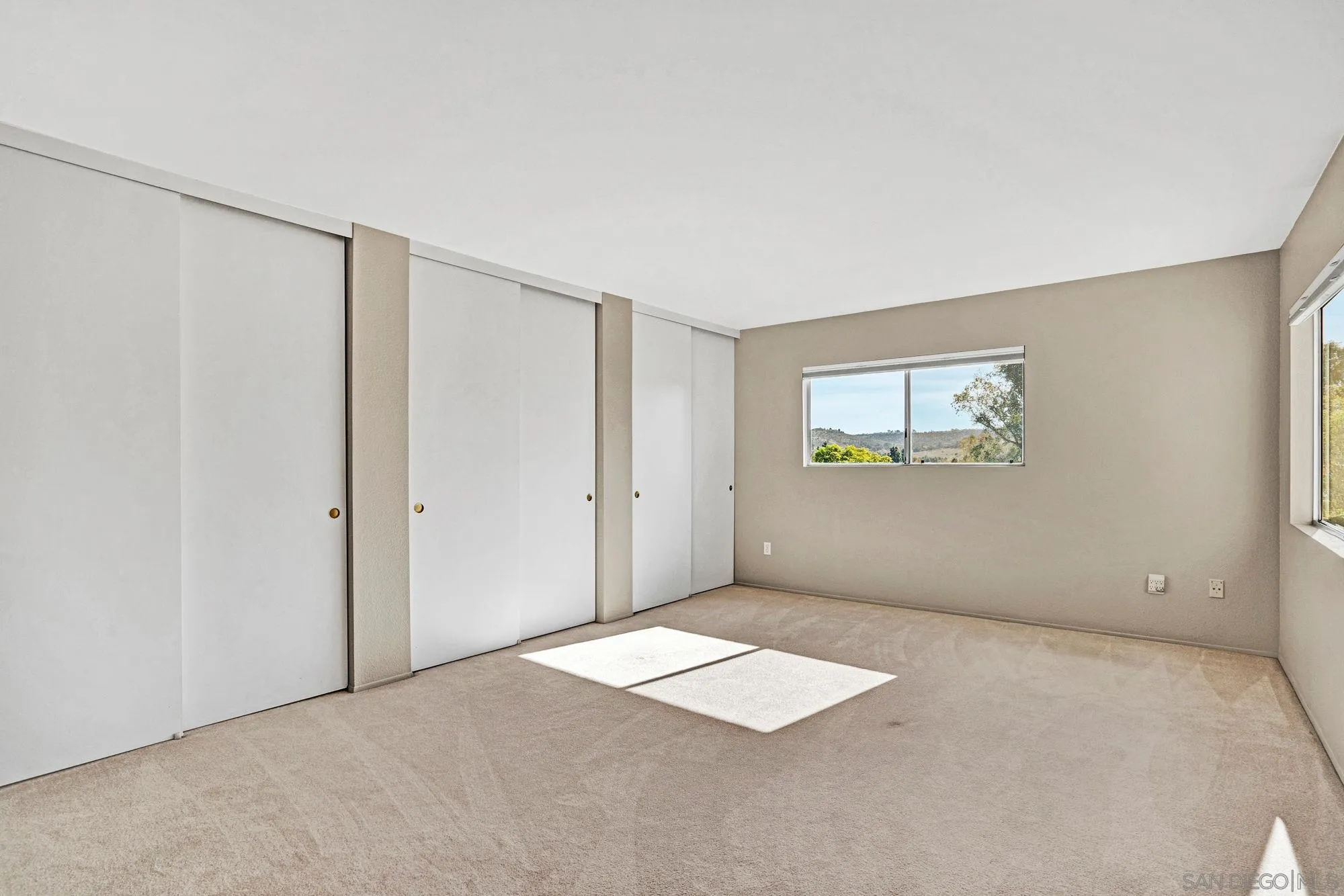 13644 Mulberry Tree Court Poway, CA 92064 - Photo 15 of 37 a view of an empty room with a window