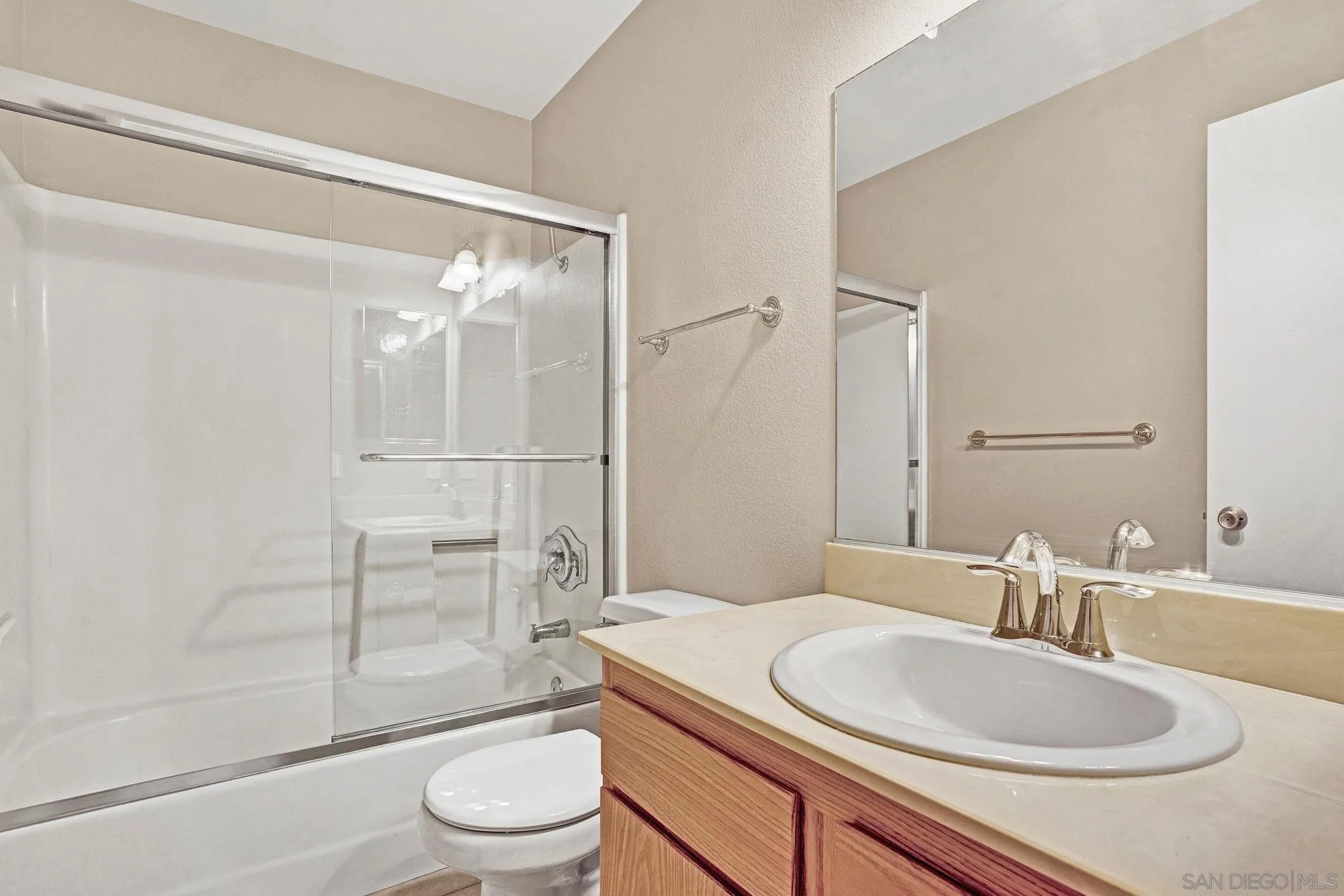 13644 Mulberry Tree Court Poway, CA 92064 - Photo 24 of 37 a bathroom with a sink toilet vanity and shower