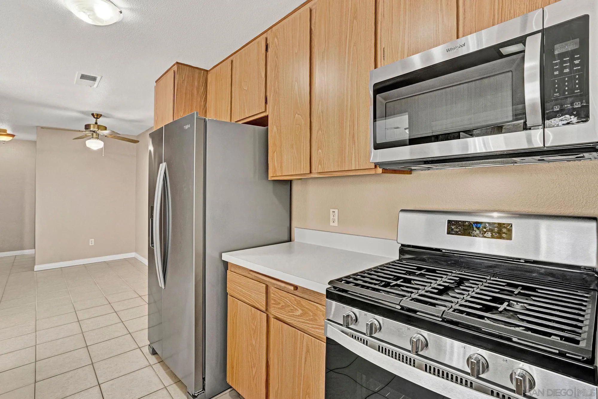 13644 Mulberry Tree Court Poway, CA 92064 - Photo 6 of 37 a kitchen with a stove and a microwave