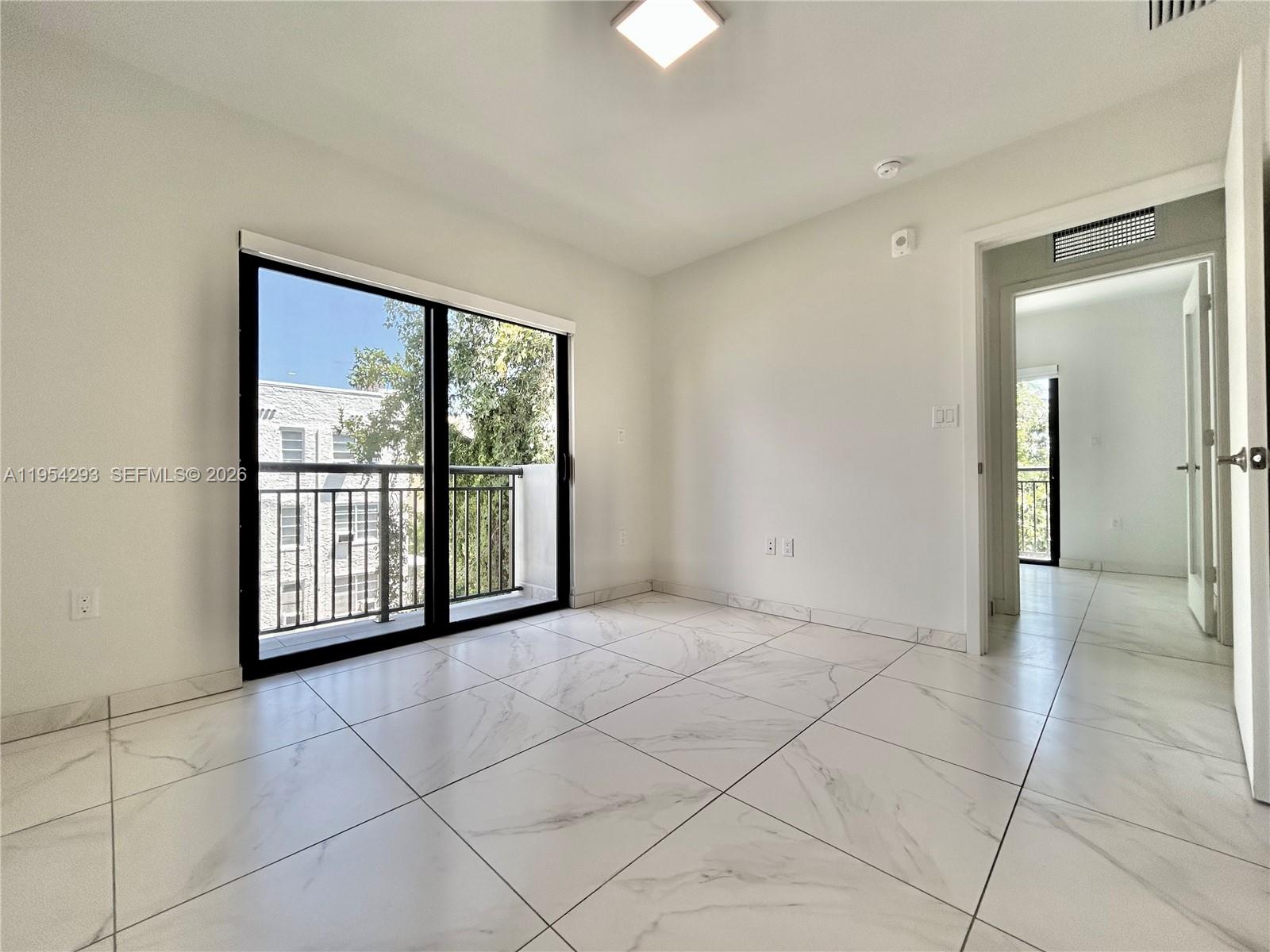 836 Southwest 2nd Street, Unit 202 Miami, FL 33130 - Photo 18 of 36 a view of an empty room with a window