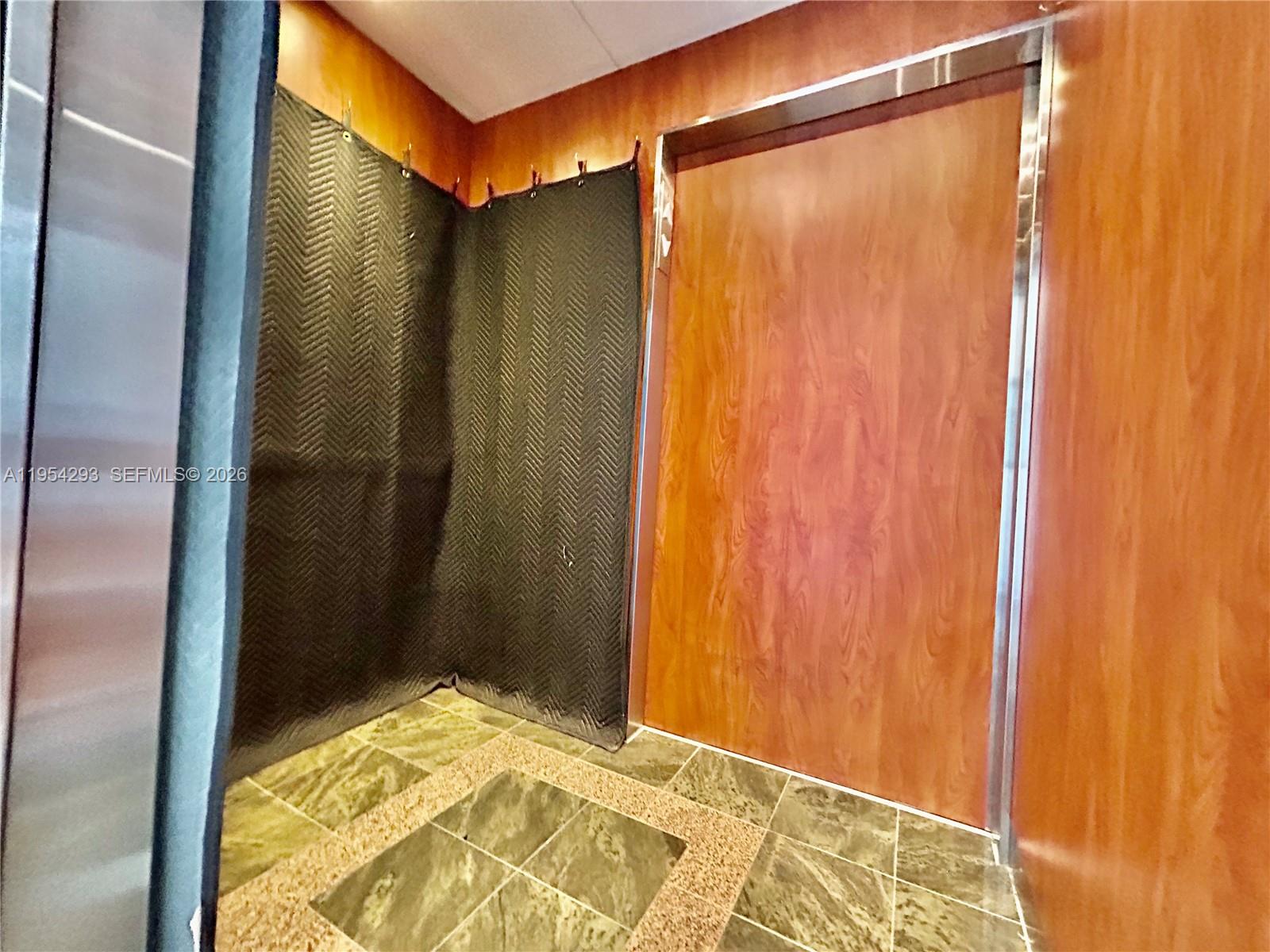 836 Southwest 2nd Street, Unit 202 Miami, FL 33130 - Photo 27 of 36 a bathroom with a shower and a tub