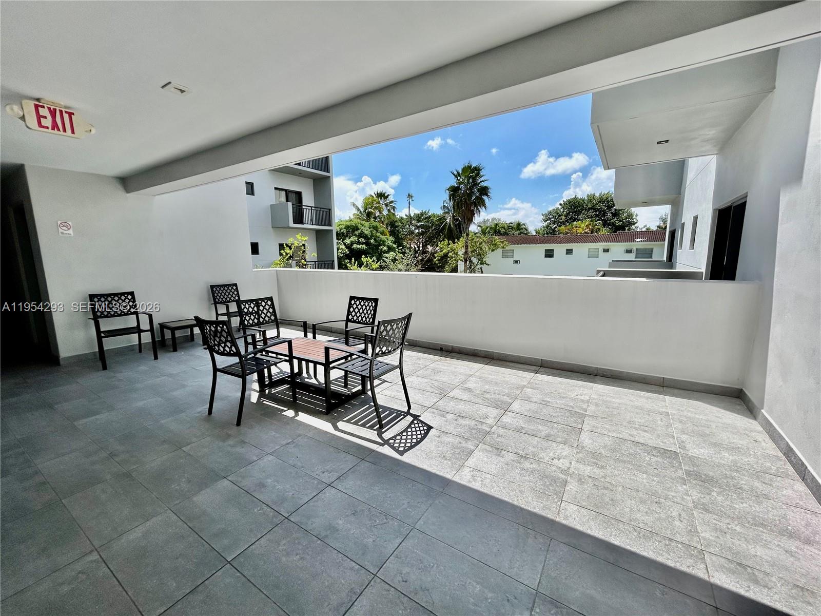 836 Southwest 2nd Street, Unit 202 Miami, FL 33130 - Photo 28 of 36 a view of a dining room with furniture and window