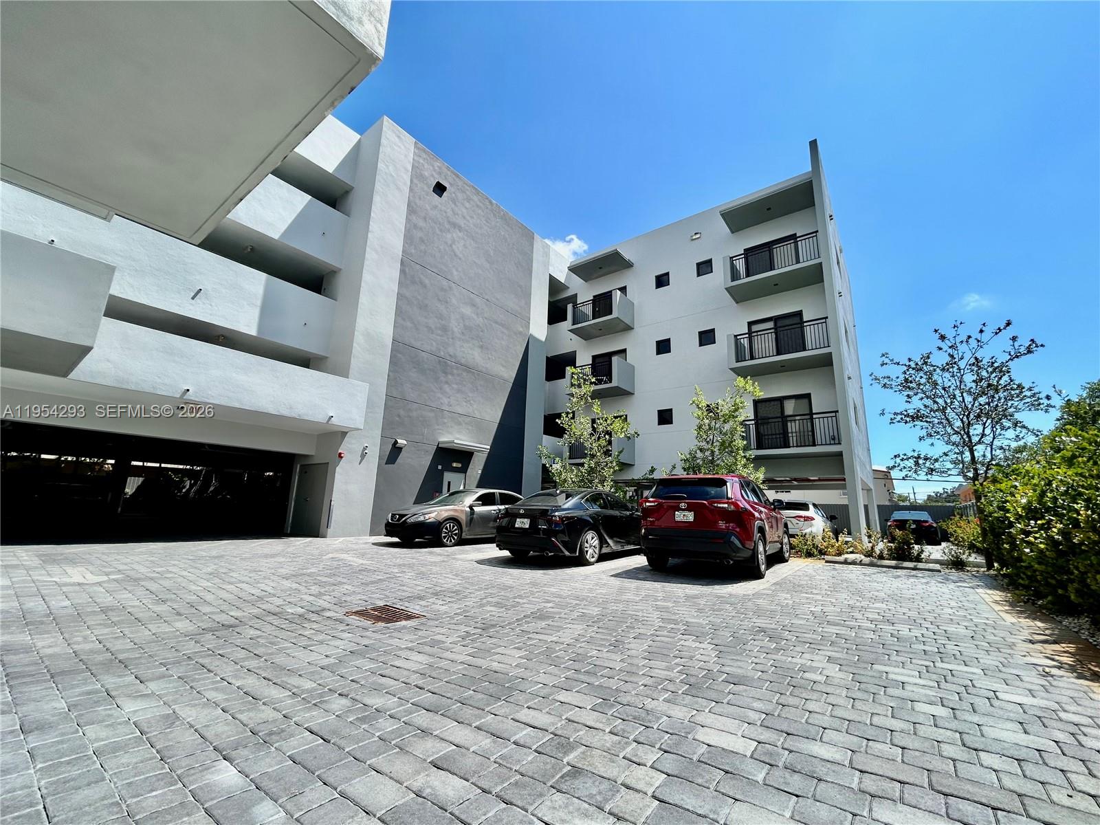 836 Southwest 2nd Street, Unit 202 Miami, FL 33130 - Photo 33 of 36 a view of a building and car parked