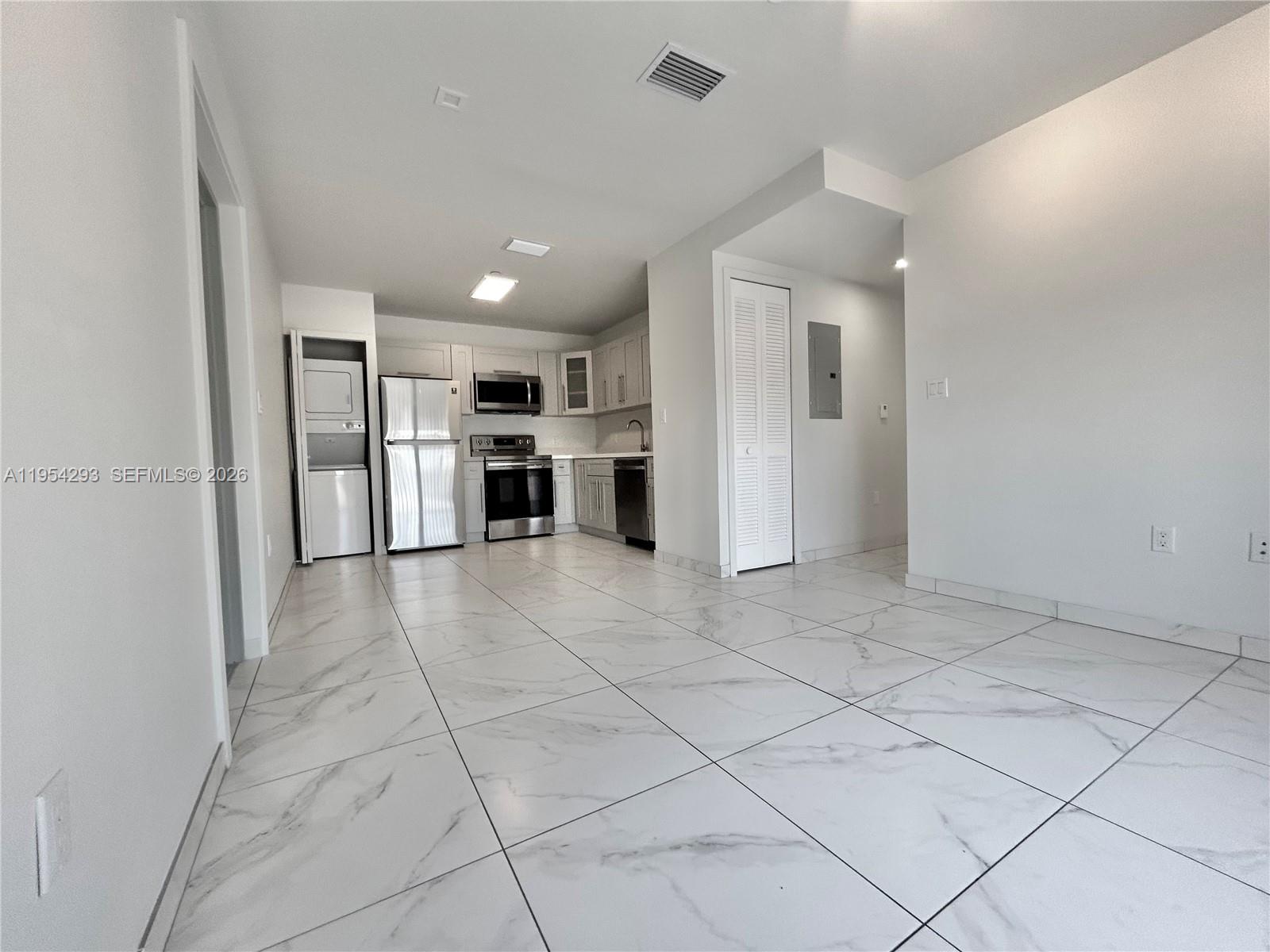 836 Southwest 2nd Street, Unit 202 Miami, FL 33130 - Photo 6 of 36 a view of a kitchen with a refrigerator cabinets and a sink