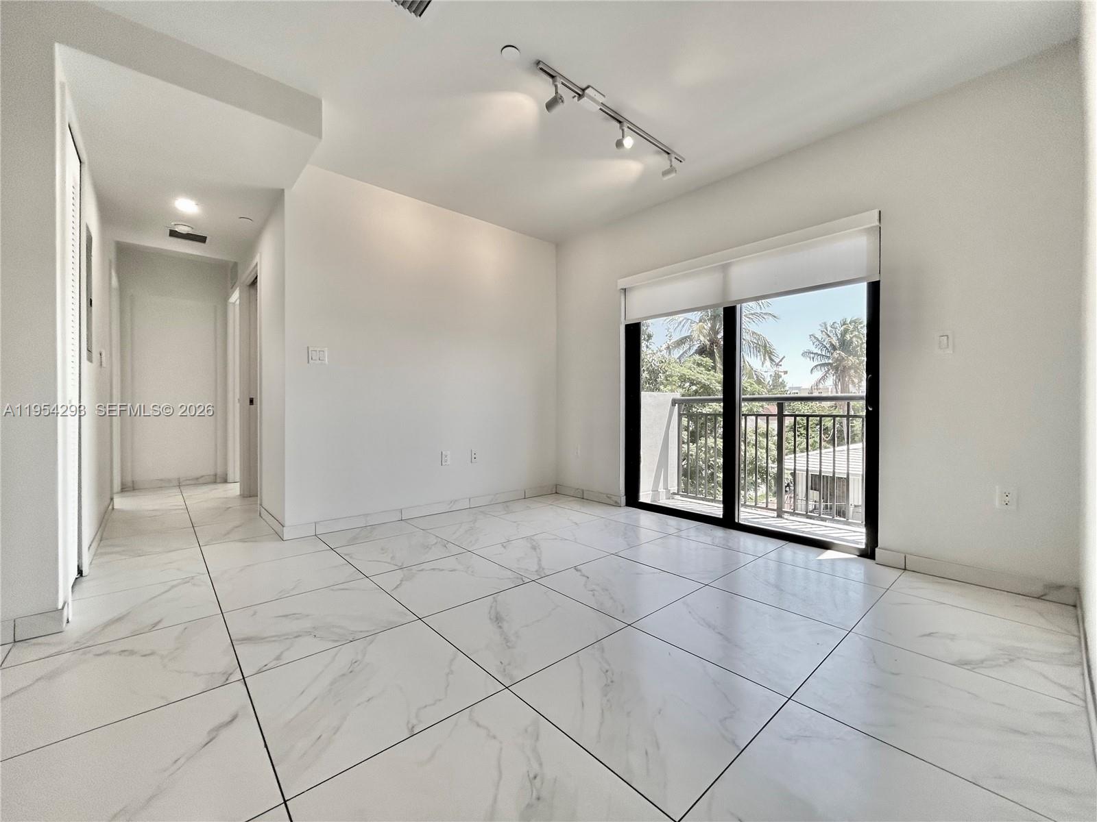 836 Southwest 2nd Street, Unit 202 Miami, FL 33130 - Photo 8 of 36 a view of an empty room with a window