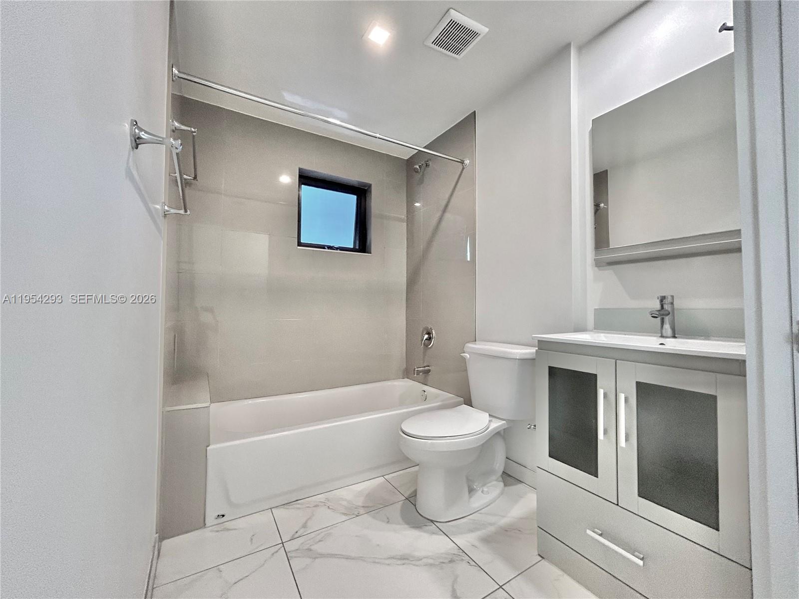 836 Southwest 2nd Street, Unit 202 Miami, FL 33130 - Photo 10 of 36 a bathroom with a sink toilet and shower