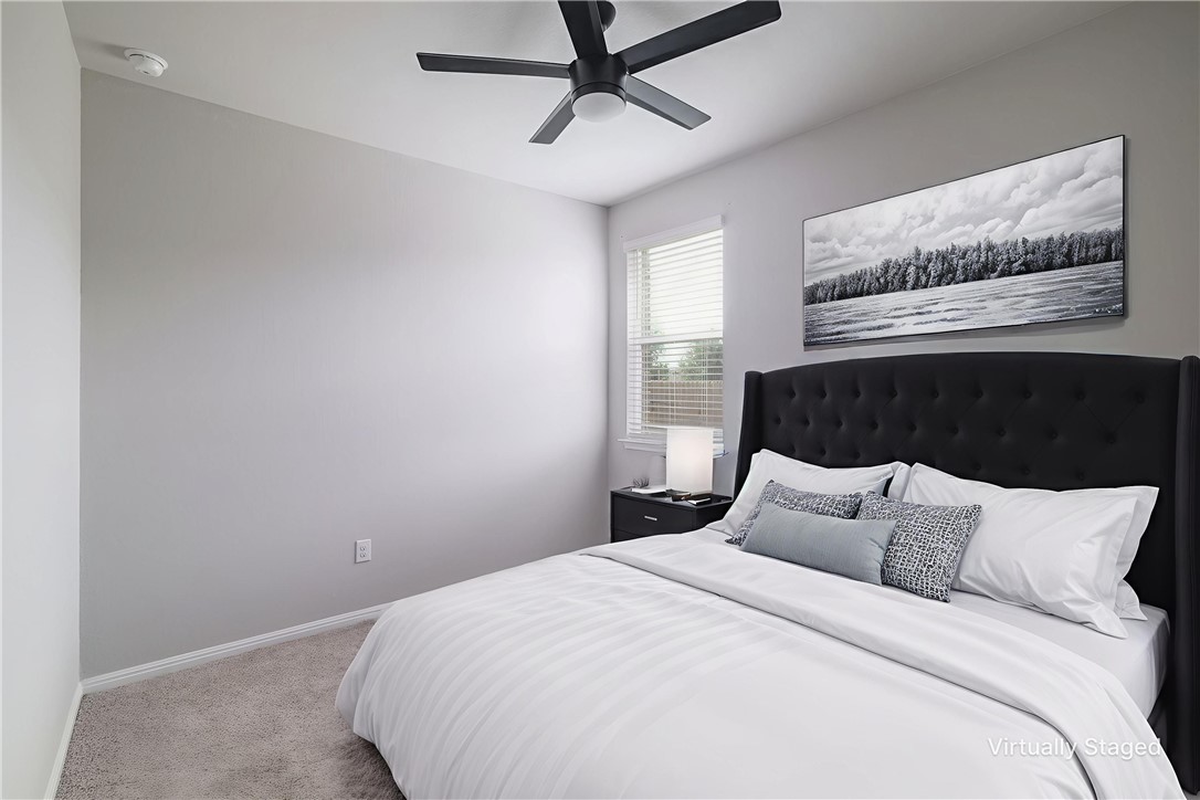 445 Shiner Lane Georgetown, TX 78626 - Photo 17 of 35 a bedroom with a bed and a window