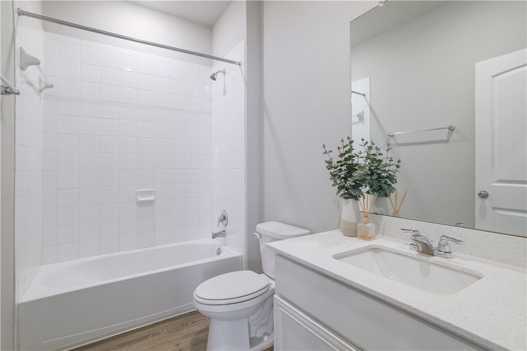 445 Shiner Lane Georgetown, TX 78626 - Photo 19 of 35 a bathroom with a sink toilet and shower