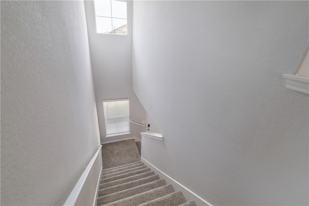 445 Shiner Lane Georgetown, TX 78626 - Photo 20 of 35 a view of a hallway with wooden floor and a bathroom
