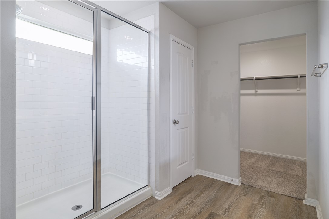445 Shiner Lane Georgetown, TX 78626 - Photo 26 of 35 a view of an empty room with wooden floor