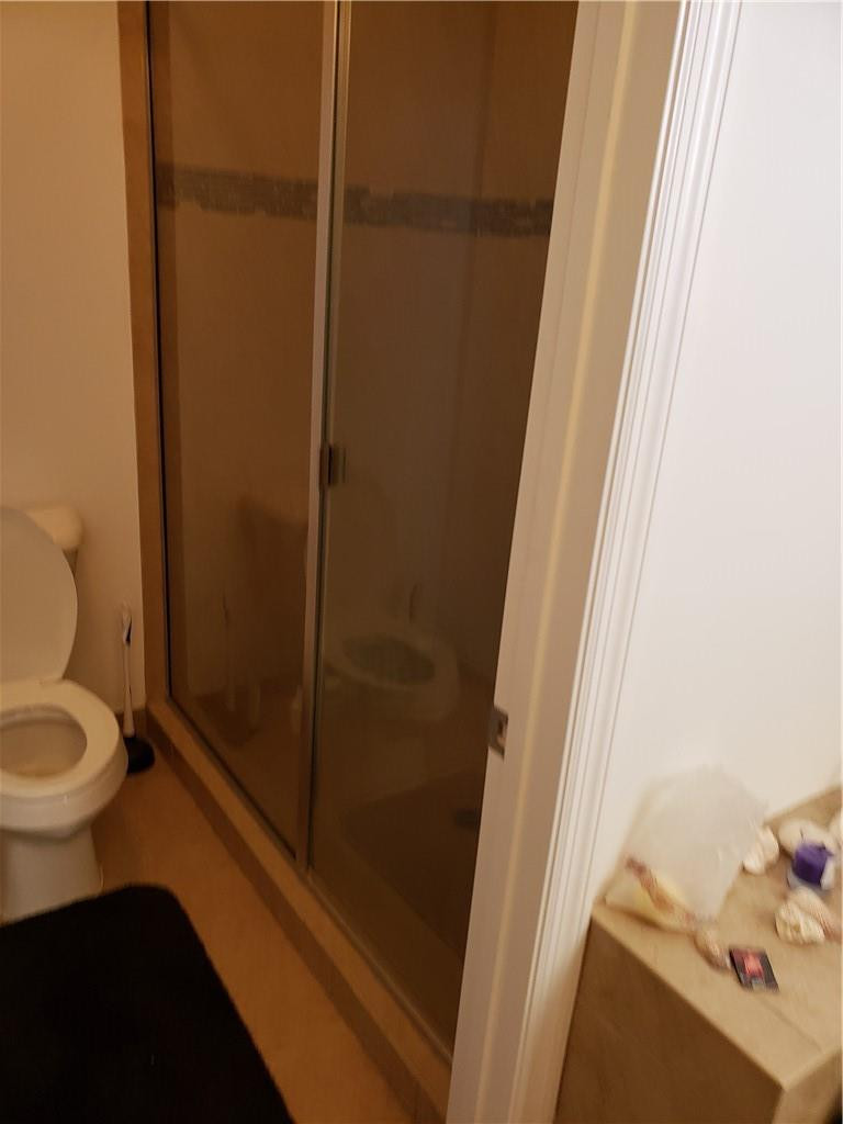 Undisclosed Address Miami, FL 33179 - Photo 12 of 24 a bathroom with a toilet and a shower