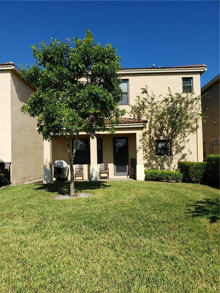Undisclosed Address Miami, FL 33179 - Photo 18 of 24 a view of a house with a yard and sitting area