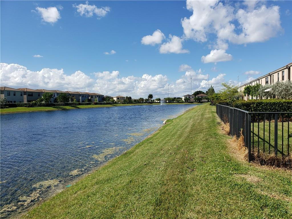 Undisclosed Address Miami, FL 33179 - Photo 19 of 24 a view of a lake with houses in the back