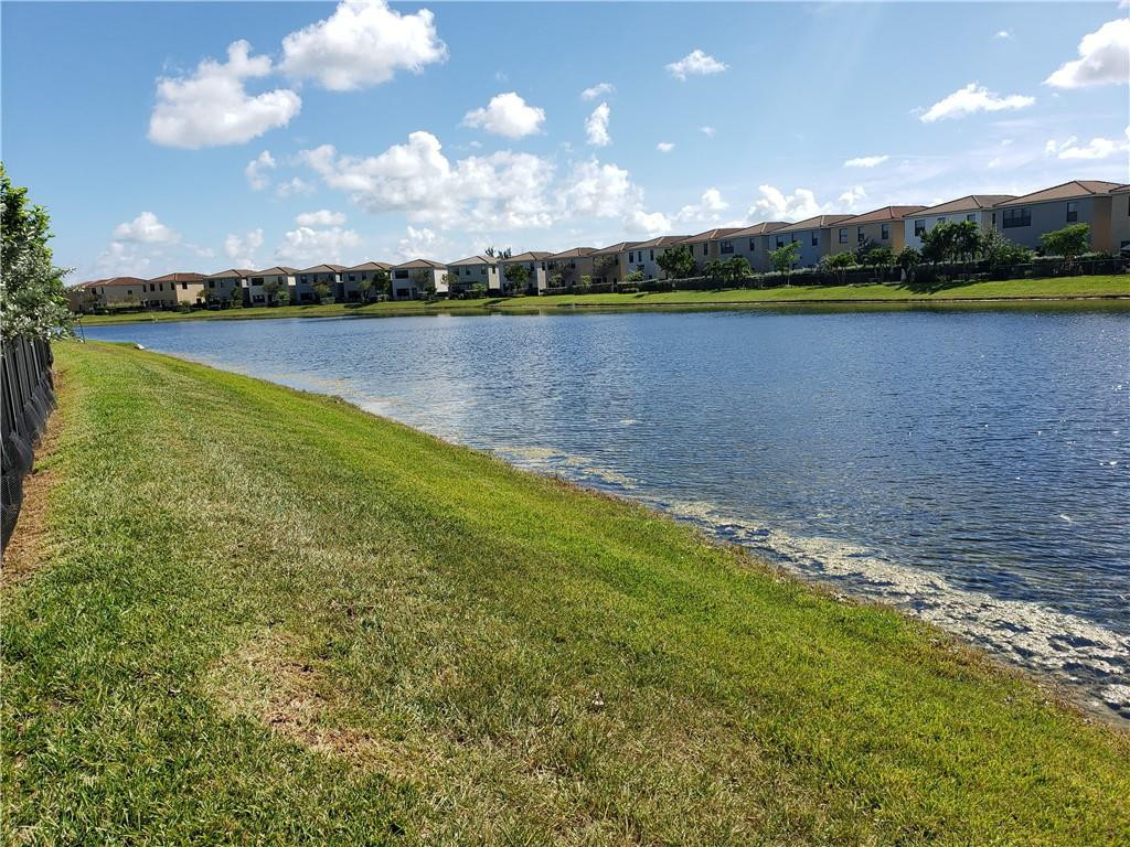 Undisclosed Address Miami, FL 33179 - Photo 20 of 24 a view of a lake in middle of a house with lake view and mountain view