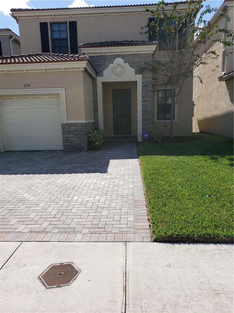 Undisclosed Address Miami, FL 33179 - Photo 2 of 24 a view of a white house with a yard