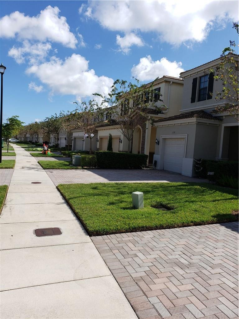 Undisclosed Address Miami, FL 33179 - Photo 21 of 24 a view of a house with a yard