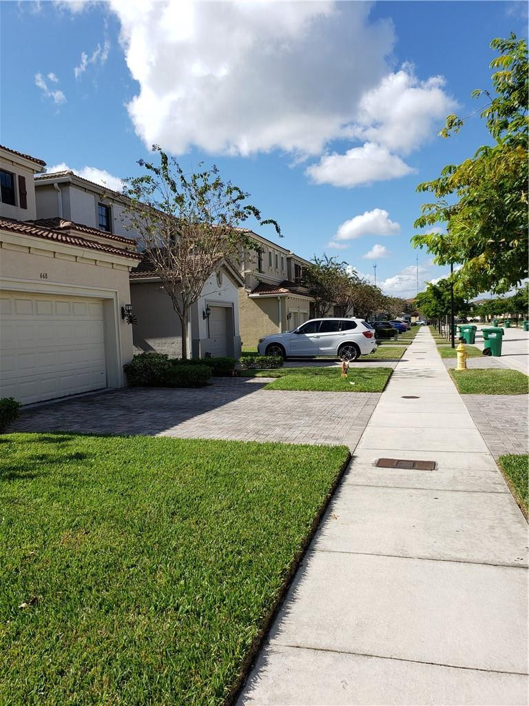 Undisclosed Address Miami, FL 33179 - Photo 22 of 24 a view of a street with houses