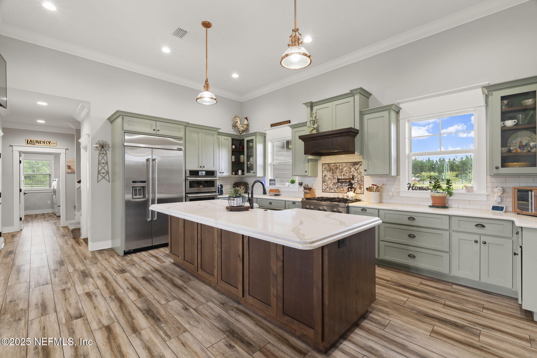 54515 Wildlife Way Callahan, FL 32011 - Photo 16 of 90 a kitchen with a sink stove and refrigerator