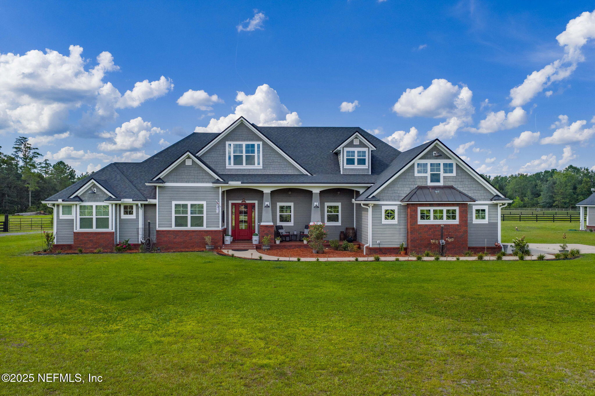 54515 Wildlife Way Callahan, FL 32011 - Photo 2 of 90 a front view of a house with garden and two chairs