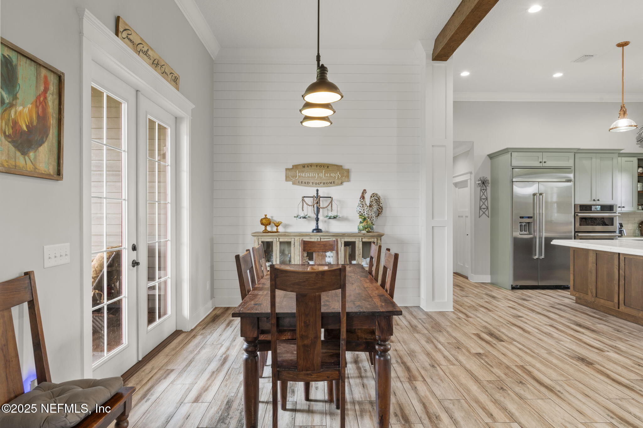 54515 Wildlife Way Callahan, FL 32011 - Photo 21 of 90 a view of a dining room with furniture window and wooden floor