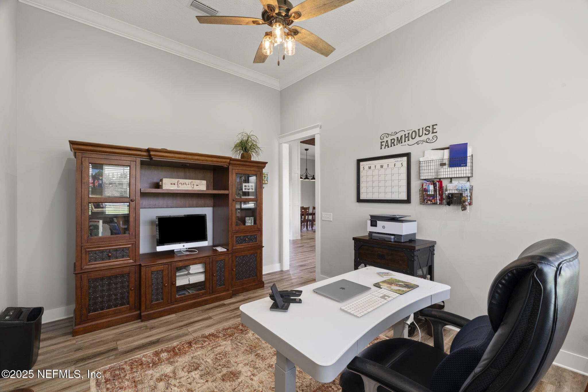 54515 Wildlife Way Callahan, FL 32011 - Photo 24 of 90 a living room with furniture and a flat screen tv
