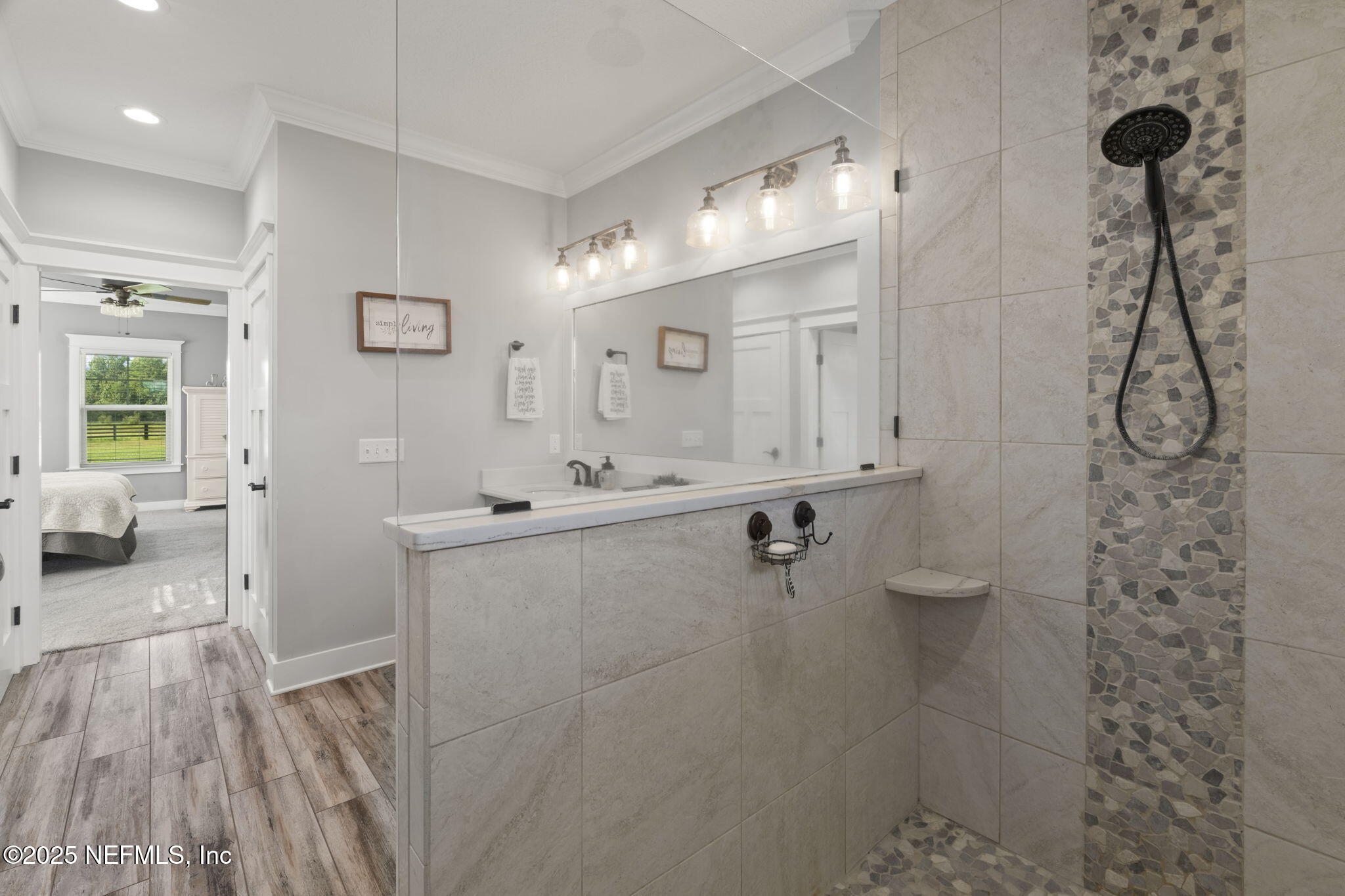 54515 Wildlife Way Callahan, FL 32011 - Photo 34 of 90 a spacious bathroom with a sink a toilet a shower and a mirror