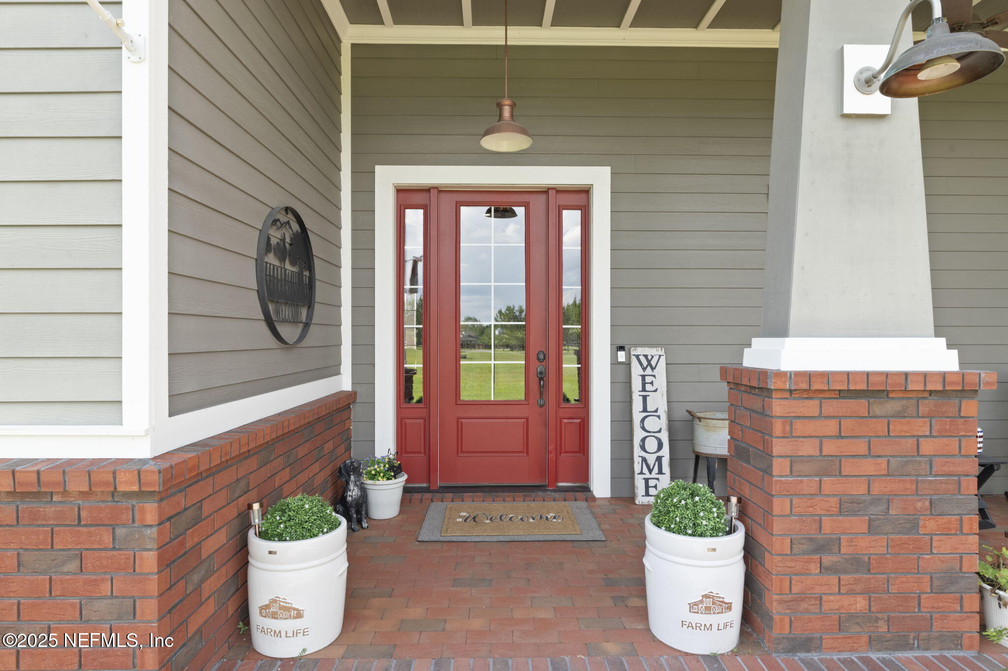 54515 Wildlife Way Callahan, FL 32011 - Photo 39 of 90 a front view of a house with a potted plant
