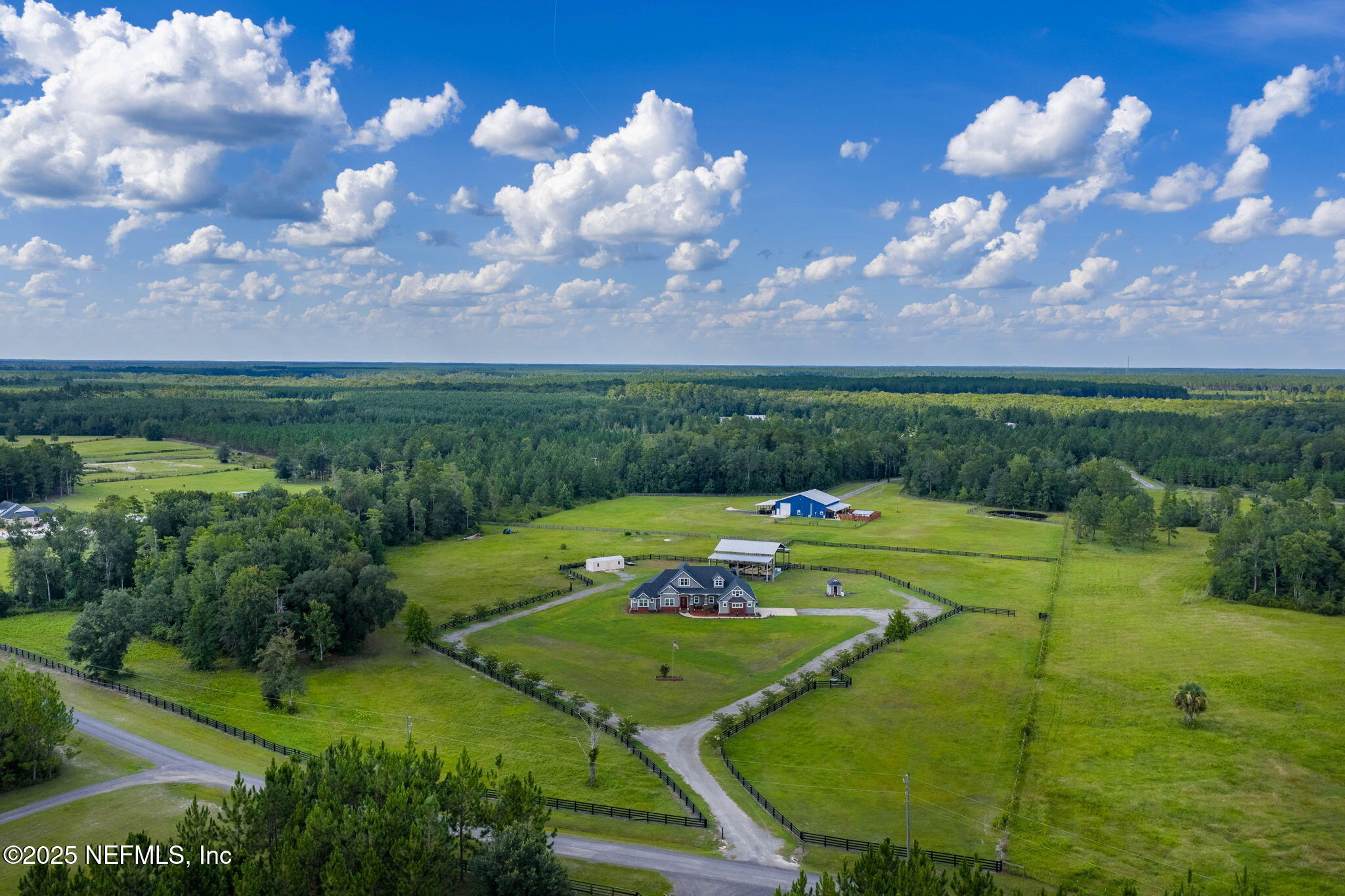 54515 Wildlife Way Callahan, FL 32011 - Photo 63 of 90 a view of a swimming pool a yard and outdoor seating