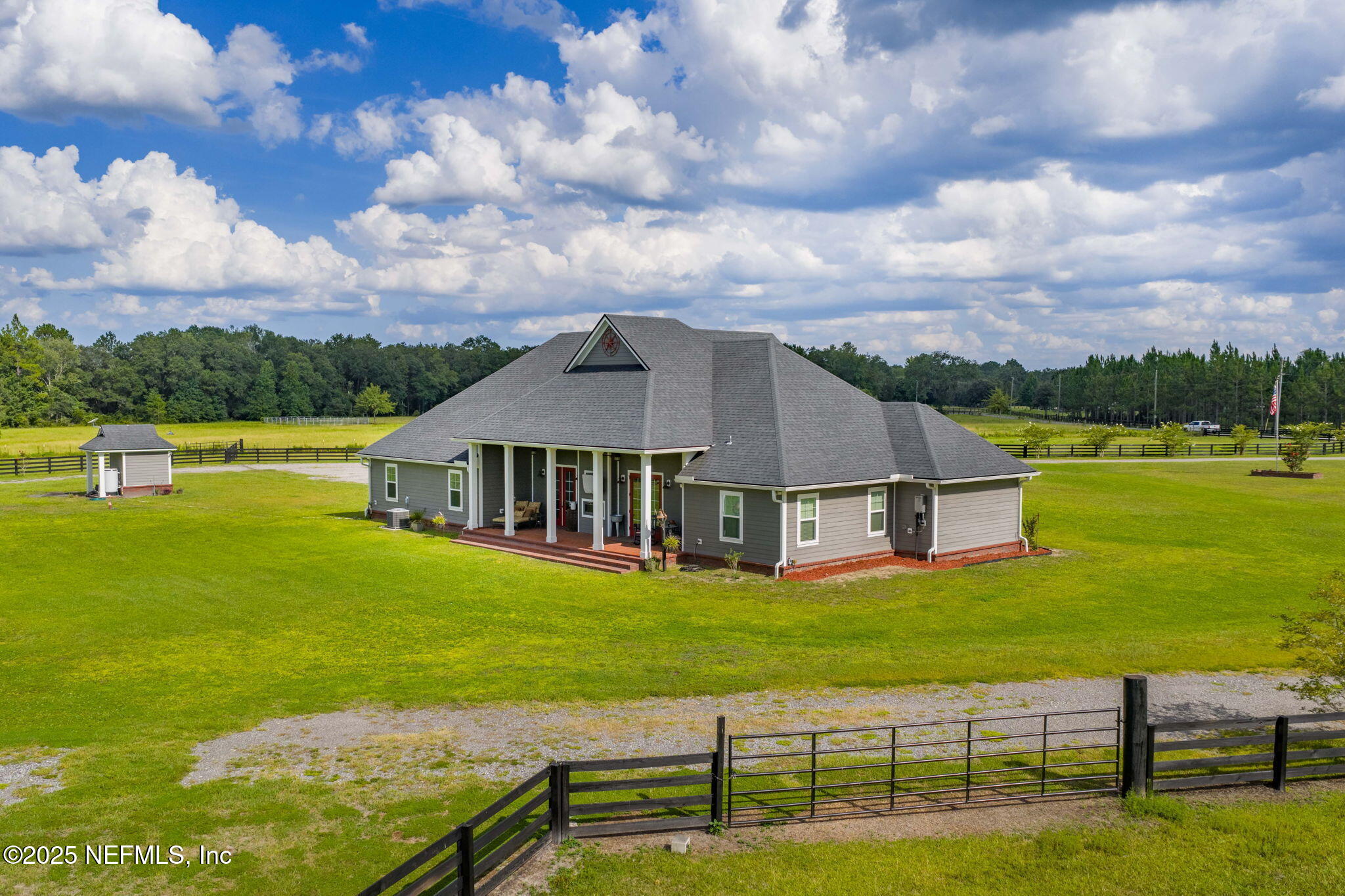 54515 Wildlife Way Callahan, FL 32011 - Photo 78 of 90 a view of a house with a big yard and a large tree