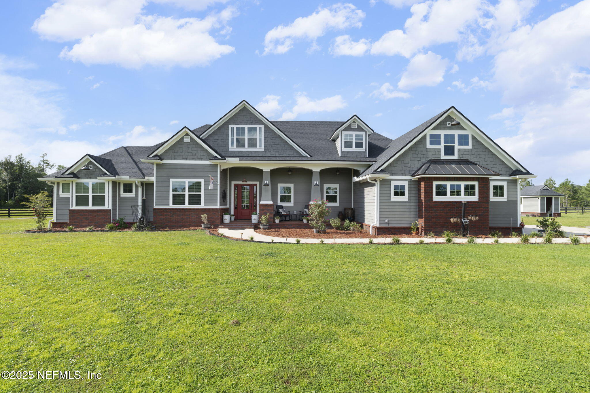 54515 Wildlife Way Callahan, FL 32011 - Photo 87 of 90 a front view of a house with swimming pool having outdoor seating