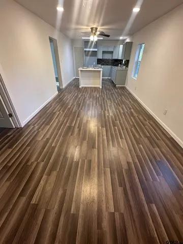 a view of storage and utility room with wooden floor