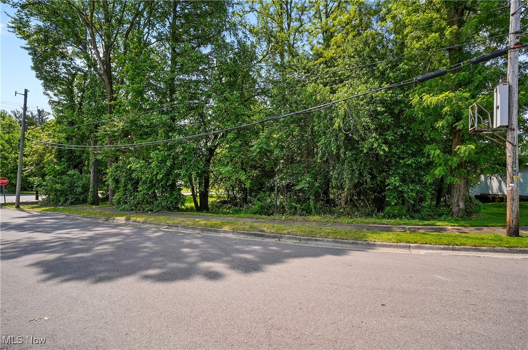1500 Home Avenue Akron, OH 44310 - Photo 1 of 7 View of asphalt road featuring traffic signs and curbs